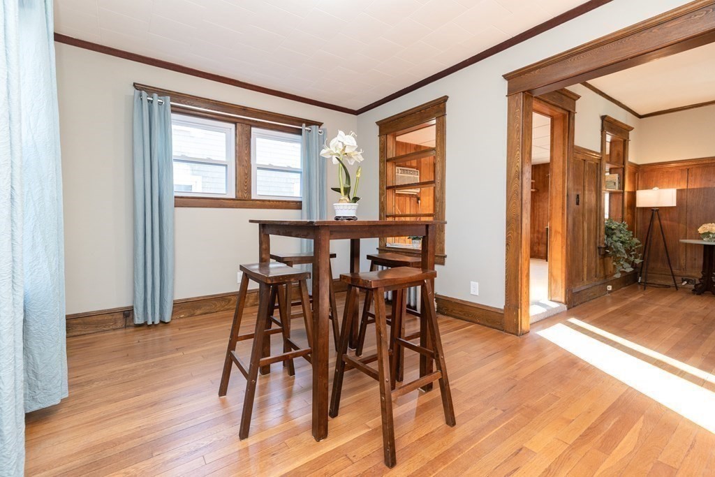 25 Daviston Street Springfield, MA 01108 - Photo 11 of 42 a view of a dining room with furniture window and wooden floor