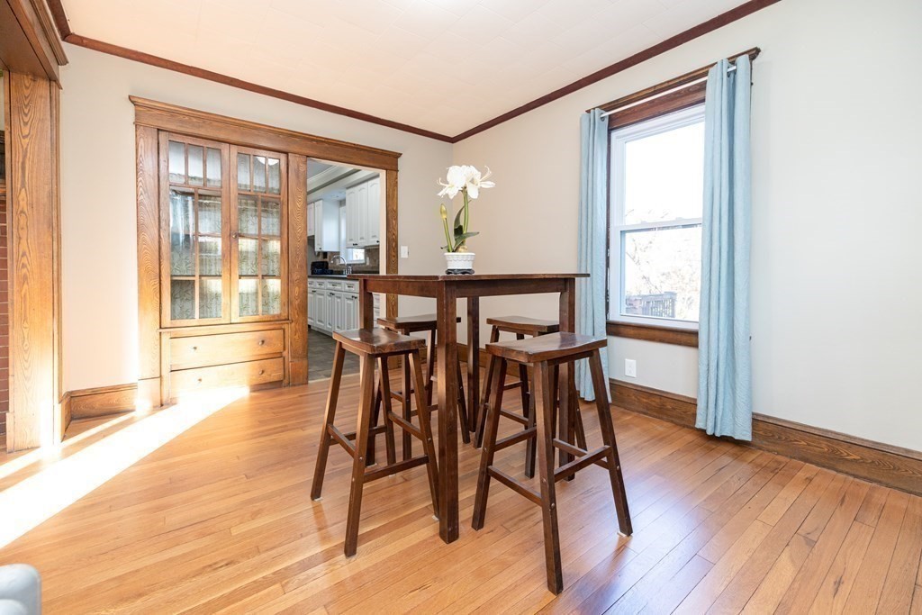 25 Daviston Street Springfield, MA 01108 - Photo 13 of 42 a view of a dining room with furniture and wooden floor