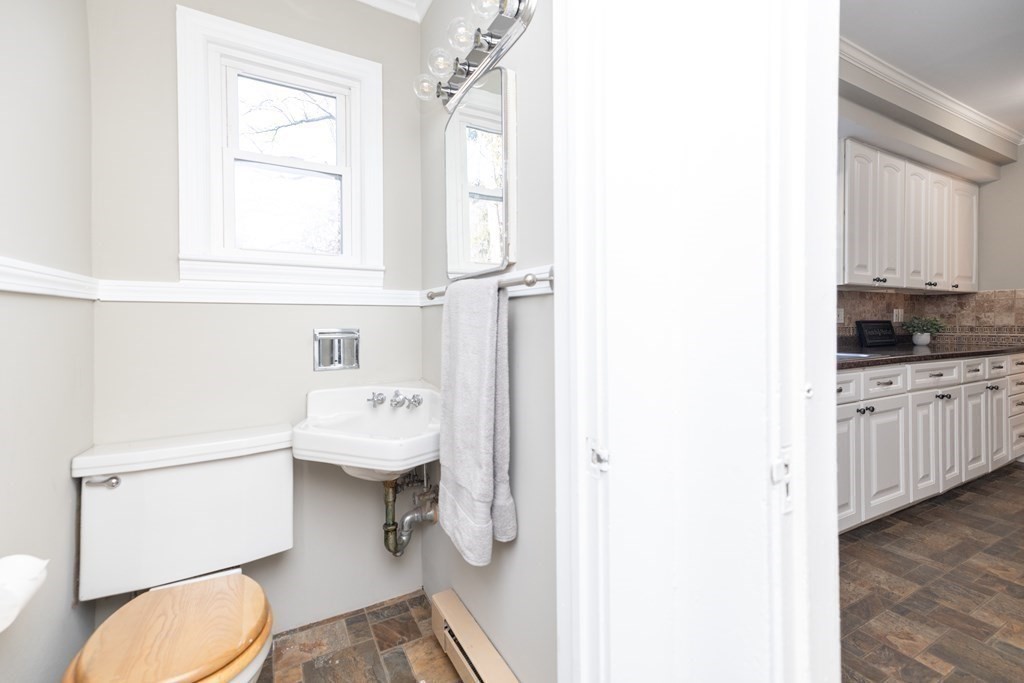25 Daviston Street Springfield, MA 01108 - Photo 19 of 42 a bathroom with a sink a toilet and a window
