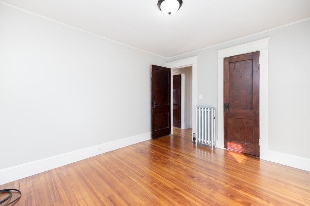 25 Daviston Street Springfield, MA 01108 - Photo 31 of 42 a view of empty room with wooden floor