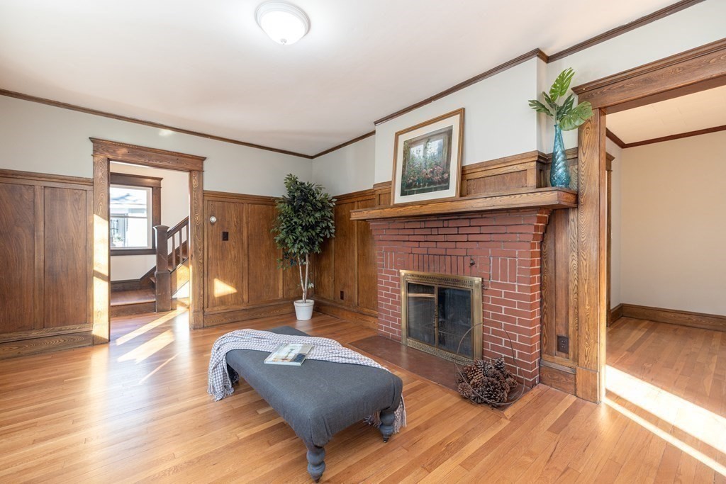 25 Daviston Street Springfield, MA 01108 - Photo 4 of 42 a living room with furniture and a fireplace
