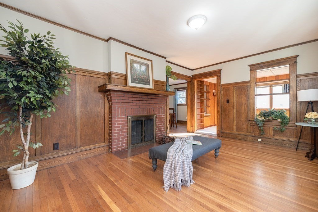 25 Daviston Street Springfield, MA 01108 - Photo 5 of 42 a living room with furniture and a fireplace