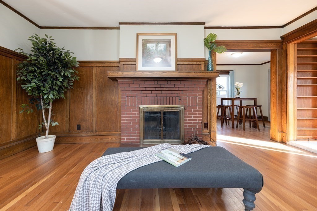 25 Daviston Street Springfield, MA 01108 - Photo 6 of 42 a view of a livingroom with furniture and a fireplace