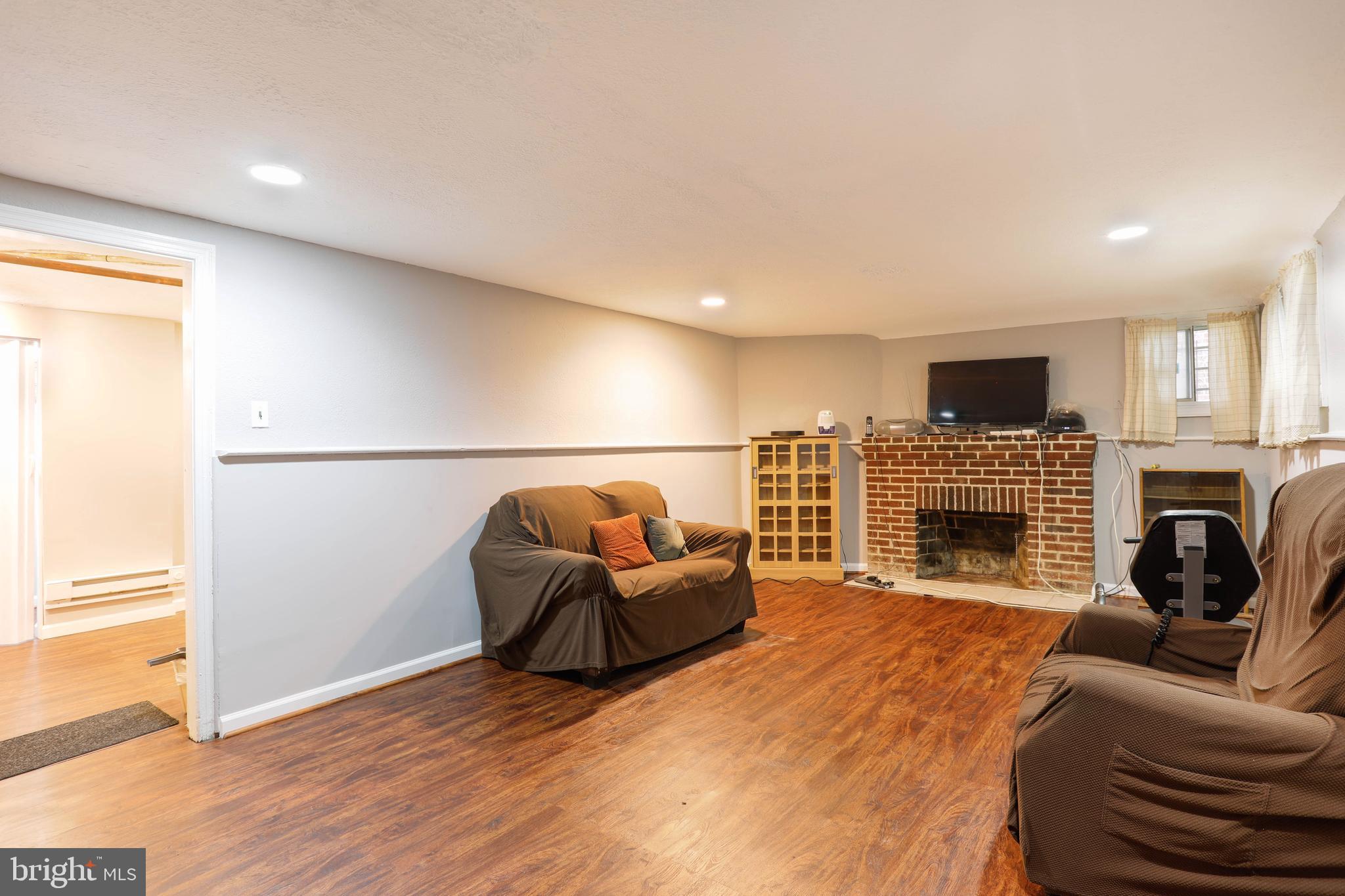423 Rittenhouse Street Northwest Washington, DC 20011 - Photo 27 of 34 Basement with fireplace