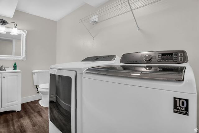 1836 West 800 North Mapleton, UT 84663 - Photo 25 of 38 Laundry area featuring washing machine and clothes dryer and dark wood-style flooring