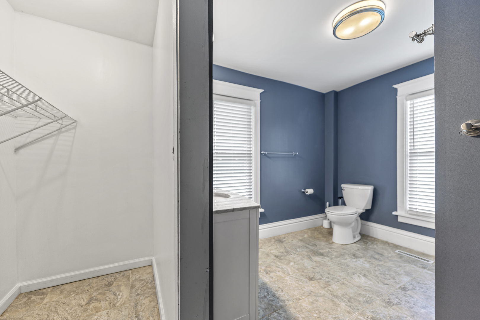 7496 Wolf Road Kingston, IL 60145 - Photo 13 of 38 a bathroom with a toilet sink and a window