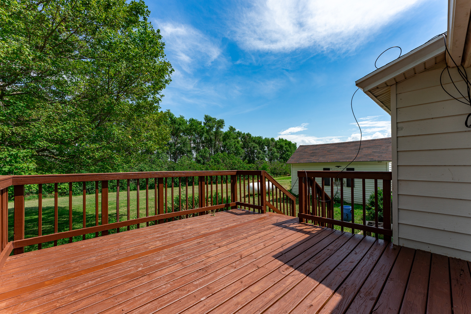 7496 Wolf Road Kingston, IL 60145 - Photo 30 of 38 a view of balcony with wooden floor