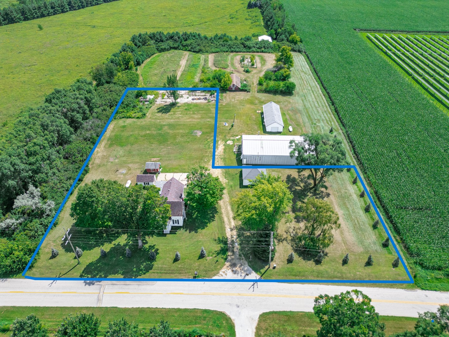 7496 Wolf Road Kingston, IL 60145 - Photo 38 of 38 an aerial view of a house with a yard basket ball court and outdoor seating