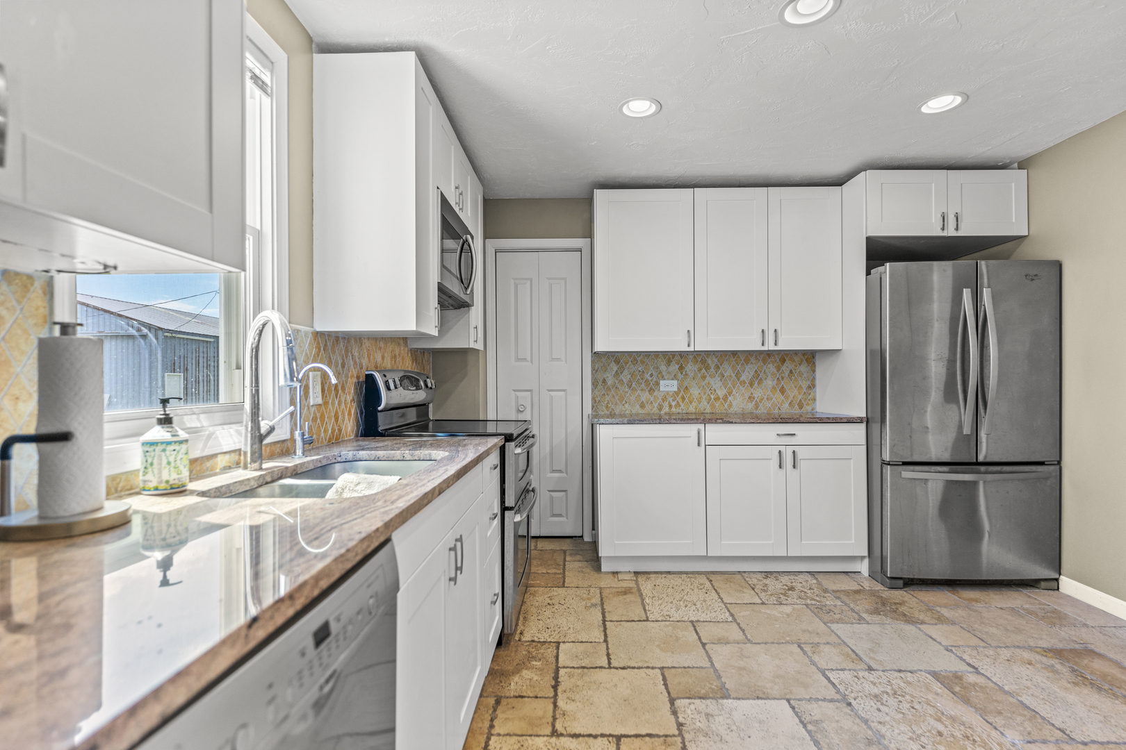 7496 Wolf Road Kingston, IL 60145 - Photo 4 of 38 a kitchen with a refrigerator sink and cabinets
