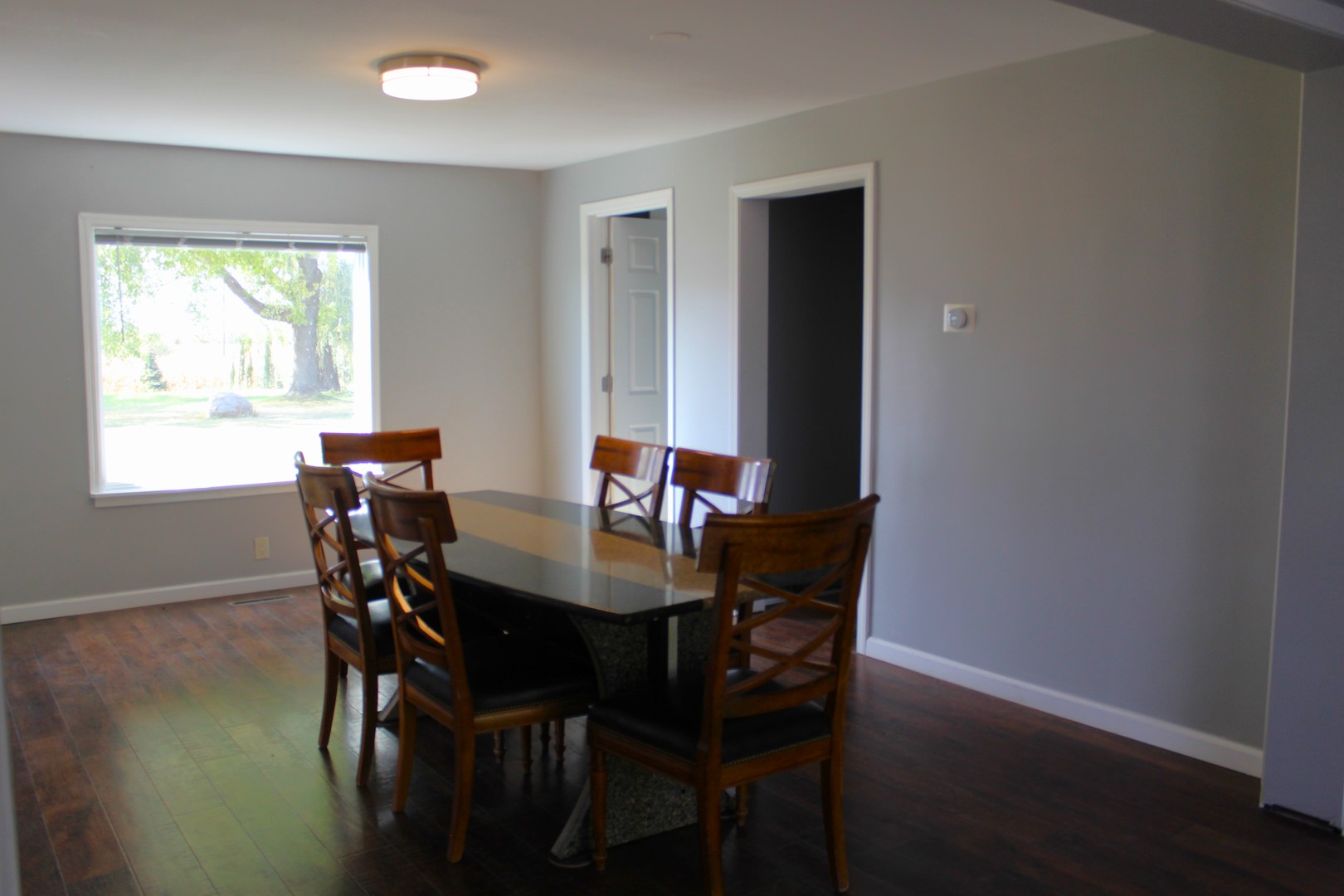 7496 Wolf Road Kingston, IL 60145 - Photo 6 of 38 a view of a dining room with a table and chairs