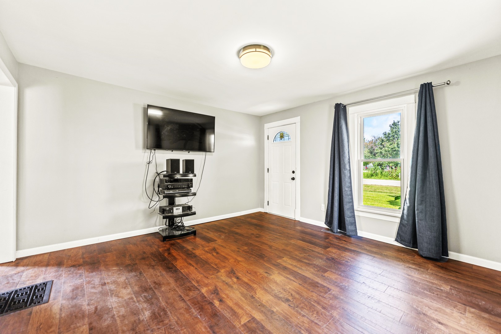 7496 Wolf Road Kingston, IL 60145 - Photo 9 of 38 a room with gym equipment and a window