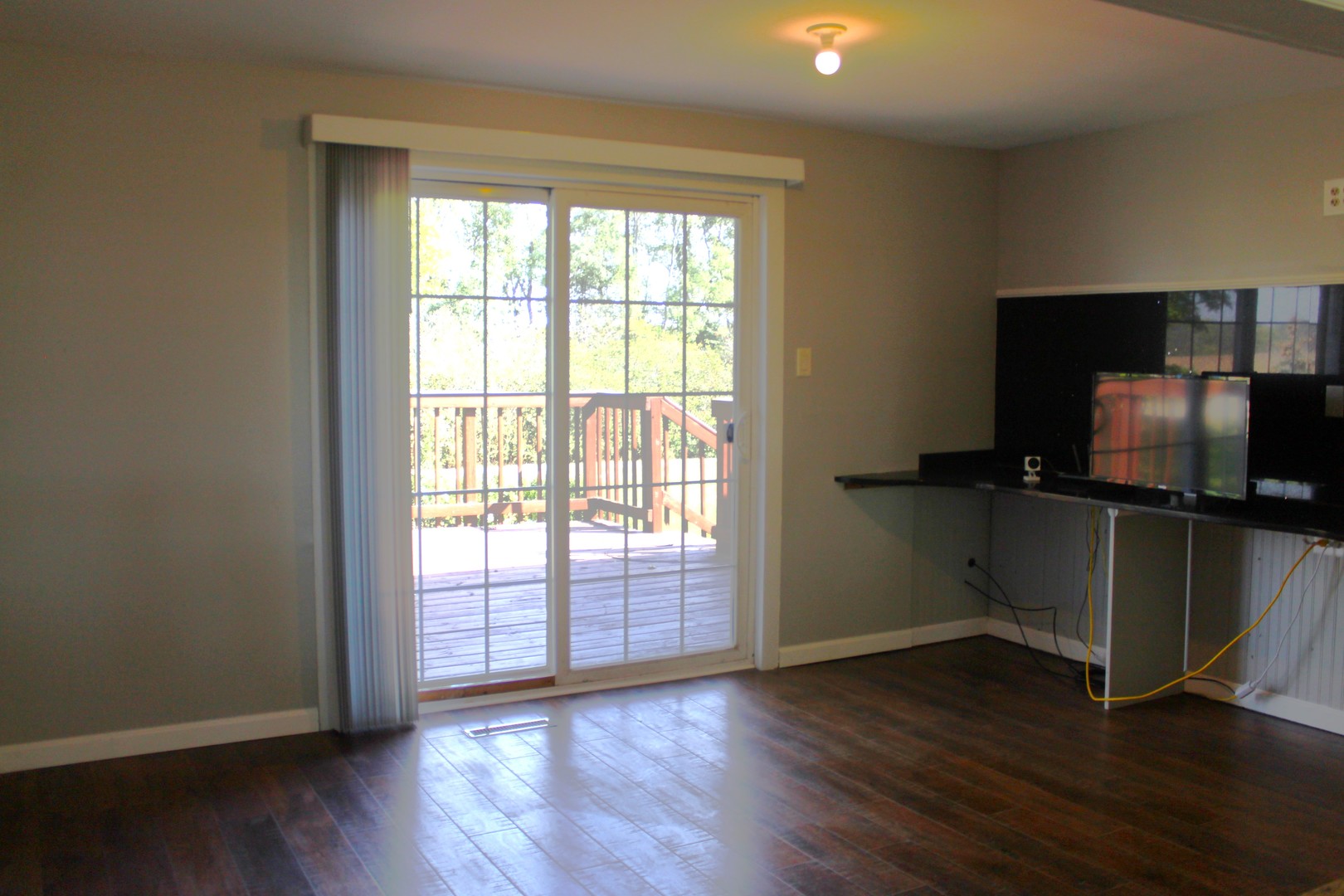 7496 Wolf Road Kingston, IL 60145 - Photo 10 of 38 a living room with wooden floor and windows