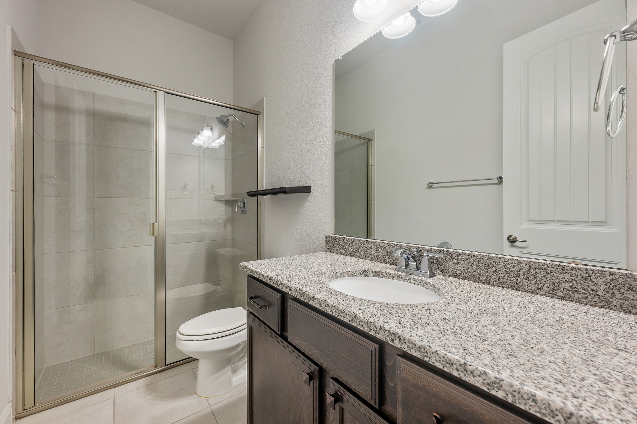 2709 Steece Way Leander, TX 78641 - Photo 39 of 39 a bathroom with a granite countertop sink toilet and shower