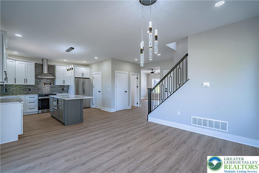261 Maple Street Coplay, PA 18037 - Photo 21 of 53 a view of kitchen with cabinets and wooden floor