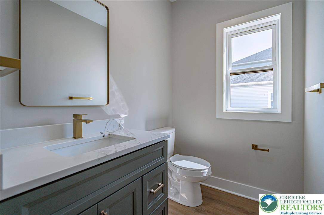 261 Maple Street Coplay, PA 18037 - Photo 22 of 53 a bathroom with a toilet sink and mirror