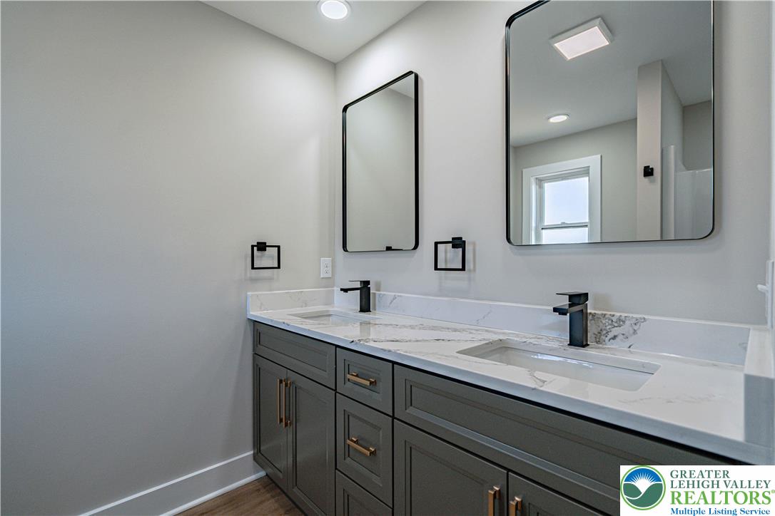 261 Maple Street Coplay, PA 18037 - Photo 28 of 53 a bathroom with a sink and a mirror
