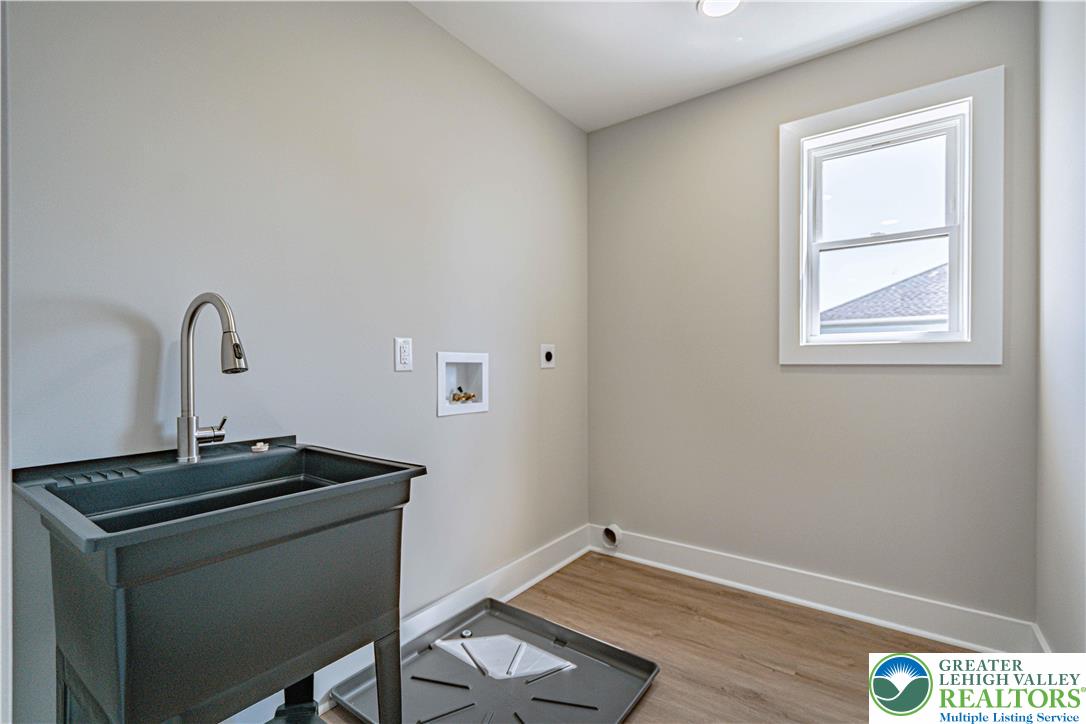 261 Maple Street Coplay, PA 18037 - Photo 29 of 53 a room with a wooden floor and a sink