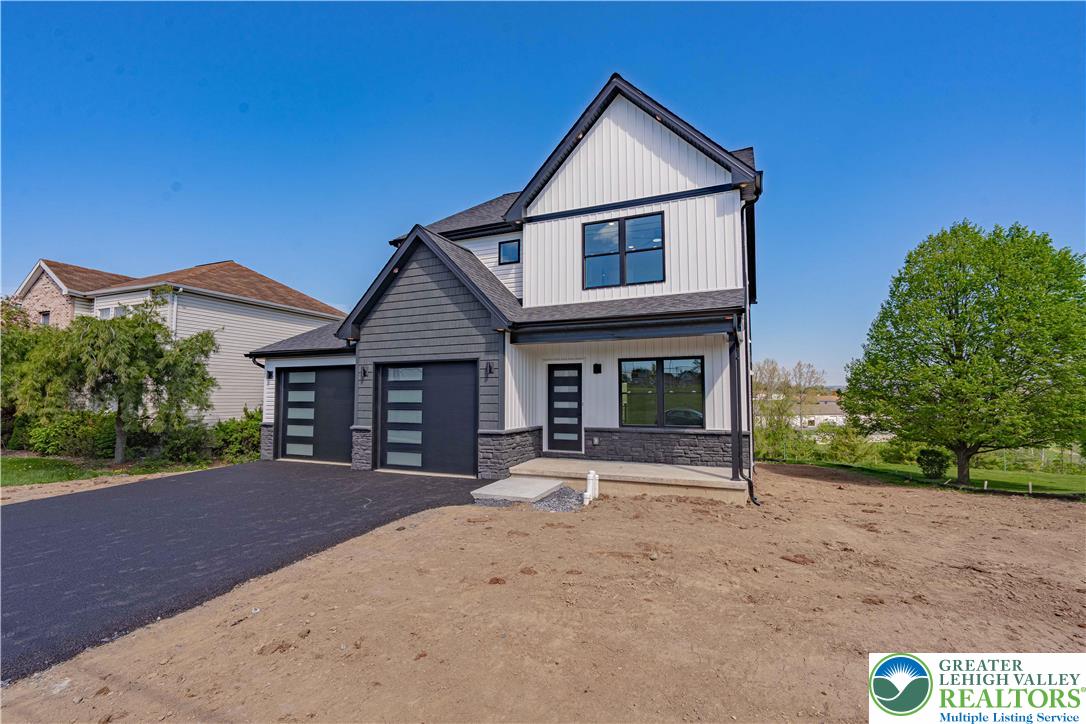 261 Maple Street Coplay, PA 18037 - Photo 3 of 53 a front view of a house with garden