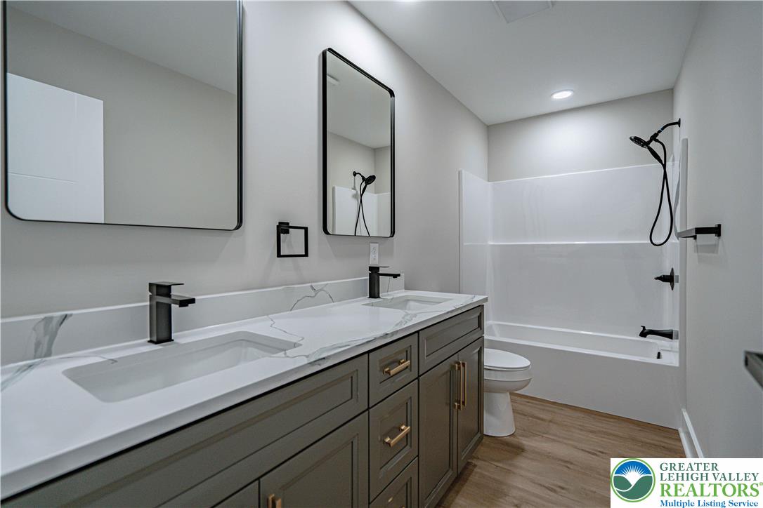 261 Maple Street Coplay, PA 18037 - Photo 32 of 53 a bathroom with a sink a toilet and shower