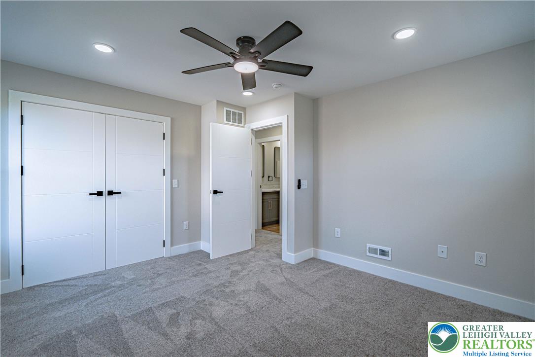 261 Maple Street Coplay, PA 18037 - Photo 34 of 53 a view of a hallway with a ceiling fan