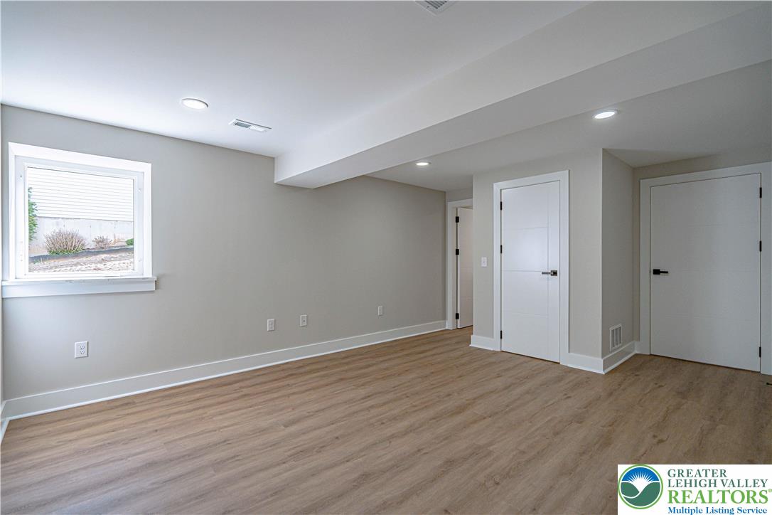 261 Maple Street Coplay, PA 18037 - Photo 39 of 53 a view of an empty room with wooden floor