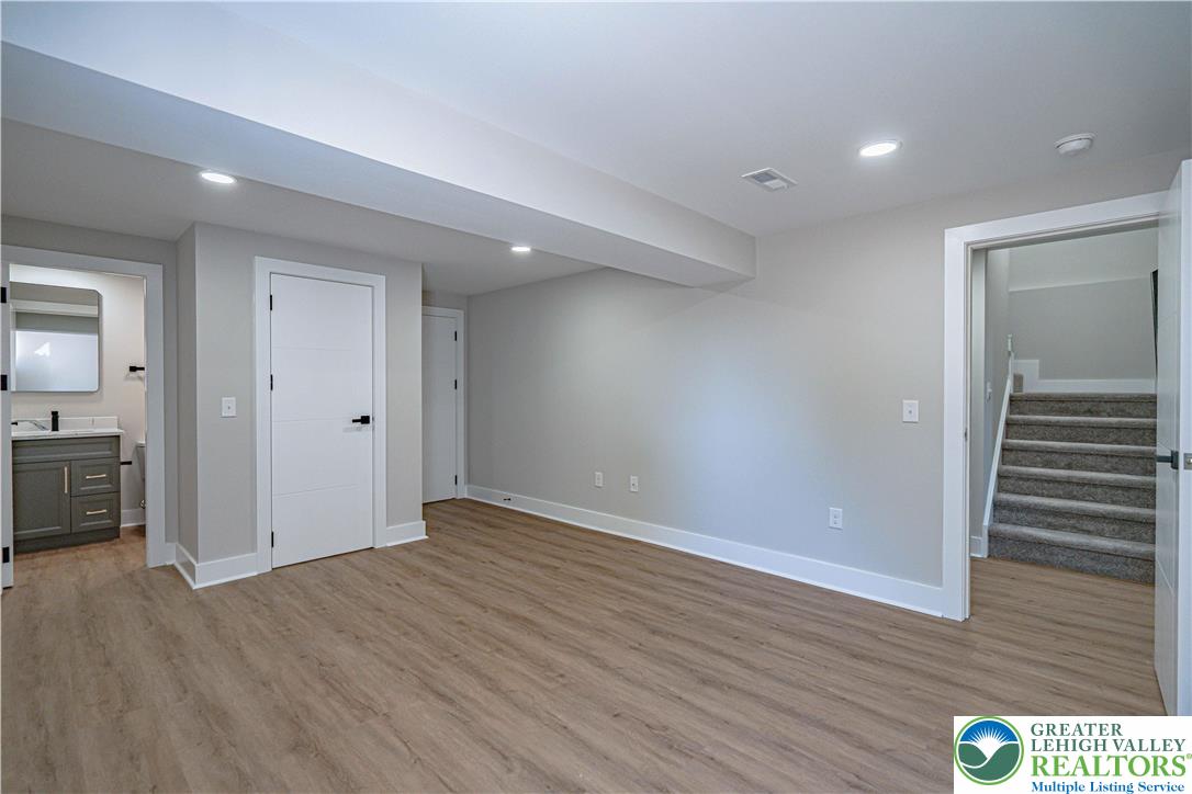 261 Maple Street Coplay, PA 18037 - Photo 40 of 53 wooden floor in an empty room with a window