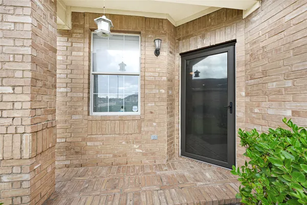 a view of a brick house with a small space