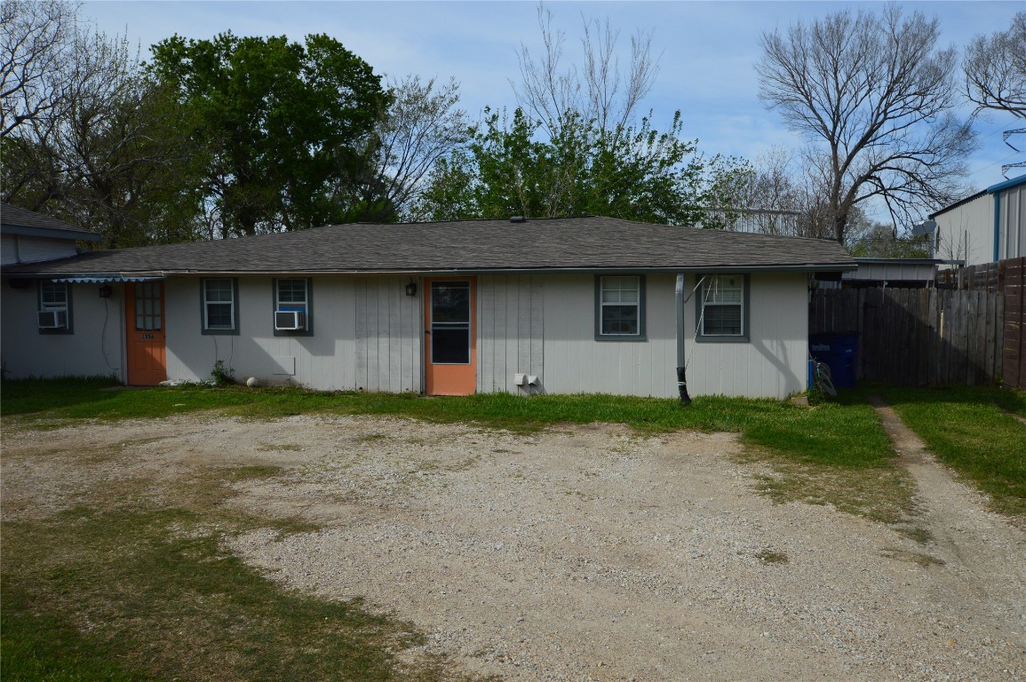 135 West 5th Street Kemah, TX 77565 - Photo 2 of 10 a front view of house with yard and trees around