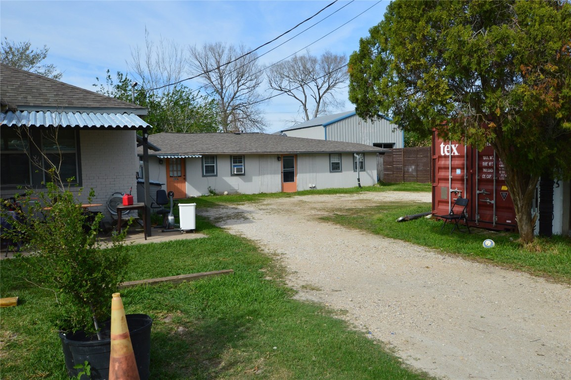 135 West 5th Street Kemah, TX 77565 - Photo 4 of 10 a front view of a house with garden