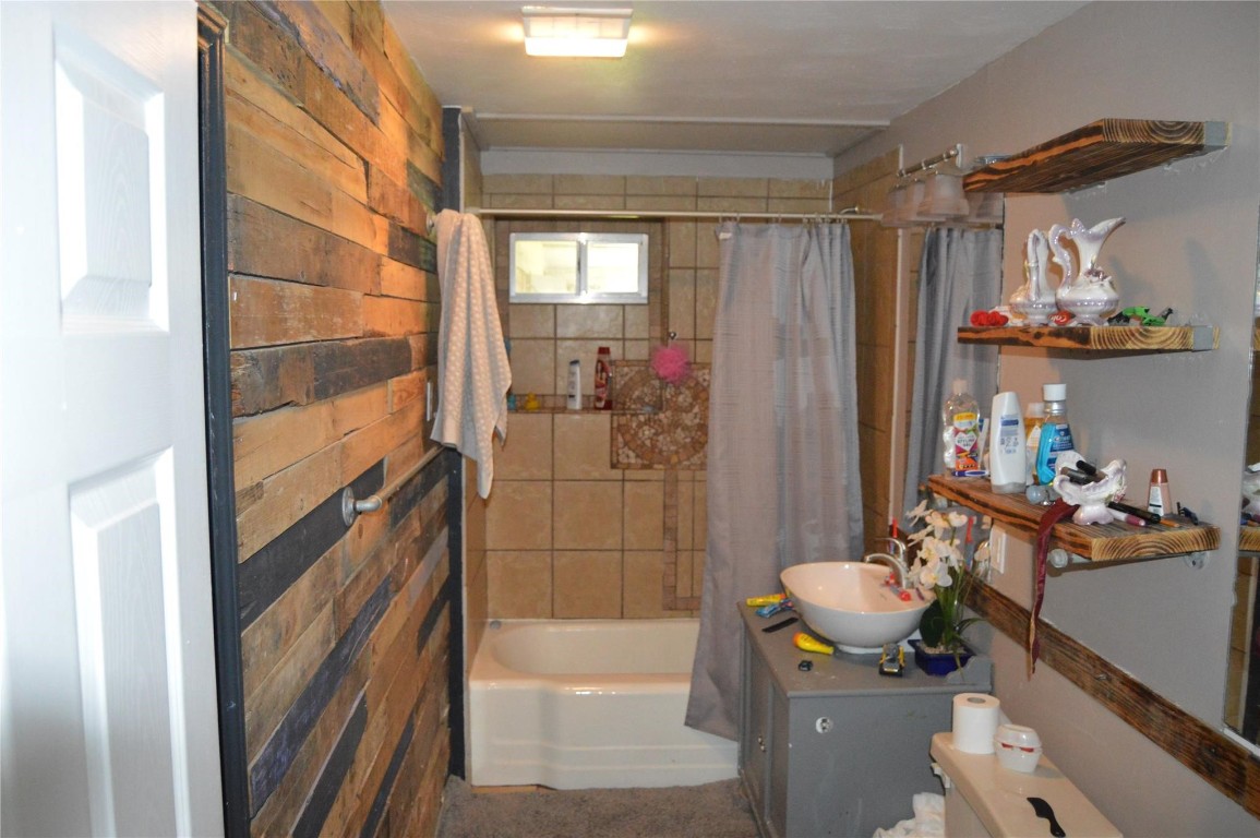 135 West 5th Street Kemah, TX 77565 - Photo 6 of 10 a bathroom with a sink a toilet and shower