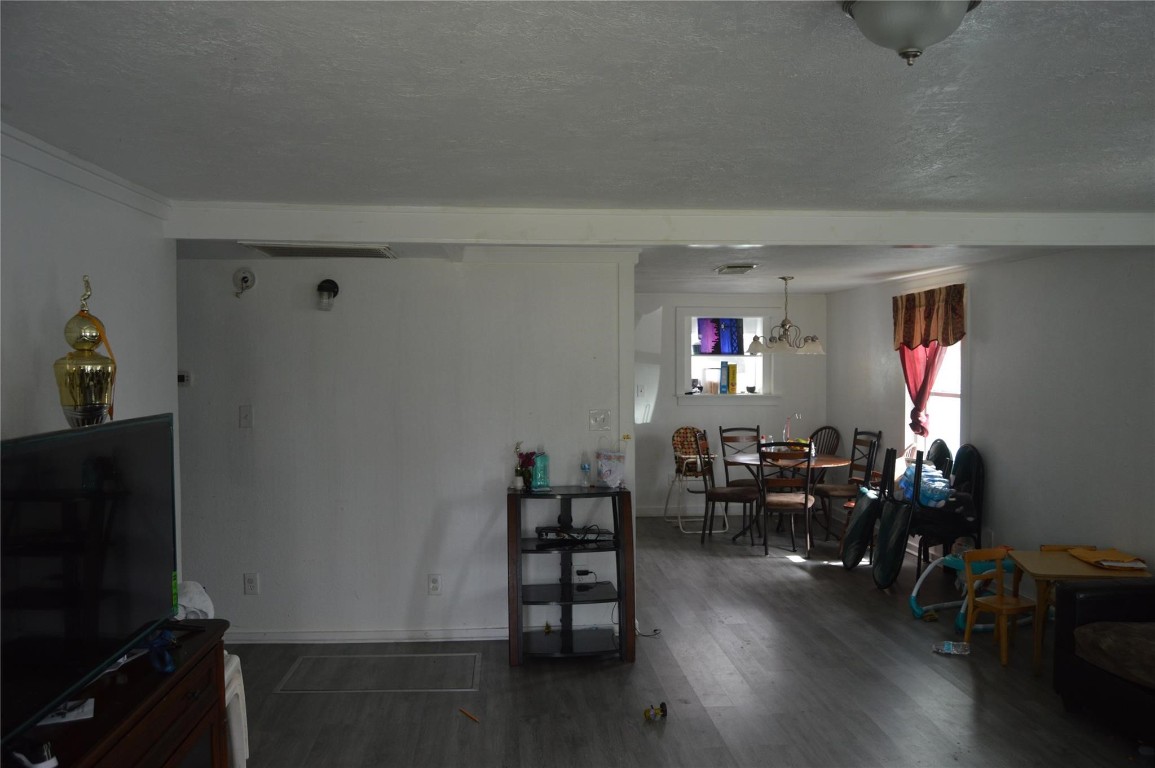 135 West 5th Street Kemah, TX 77565 - Photo 9 of 10 a living room with furniture and a flat screen tv