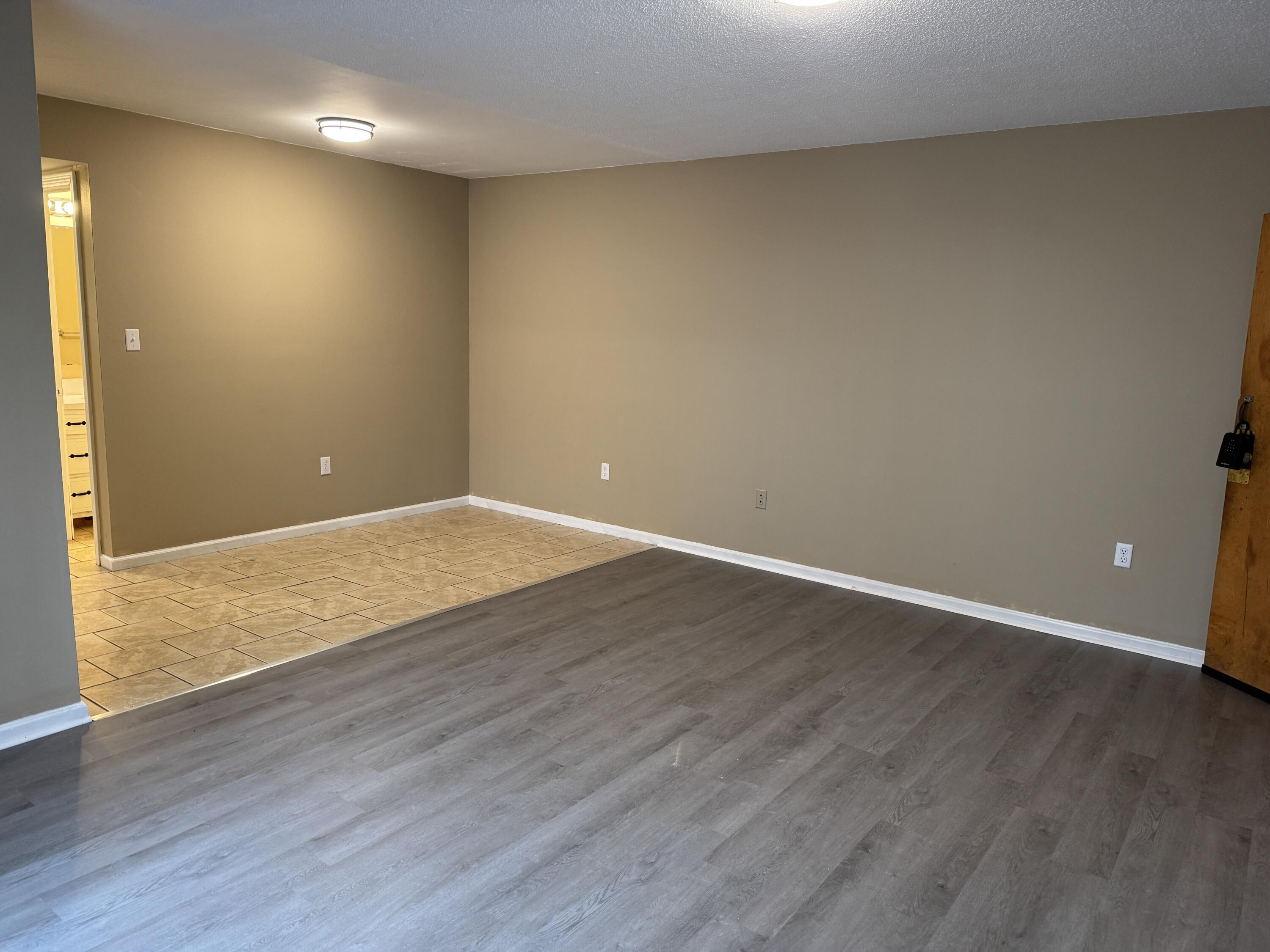 45 Vera Avenue, Unit 6 Collinsville, VA 24078 - Photo 4 of 8 a view of an empty room with wooden floor