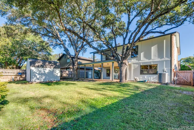 a view of a back yard of the house