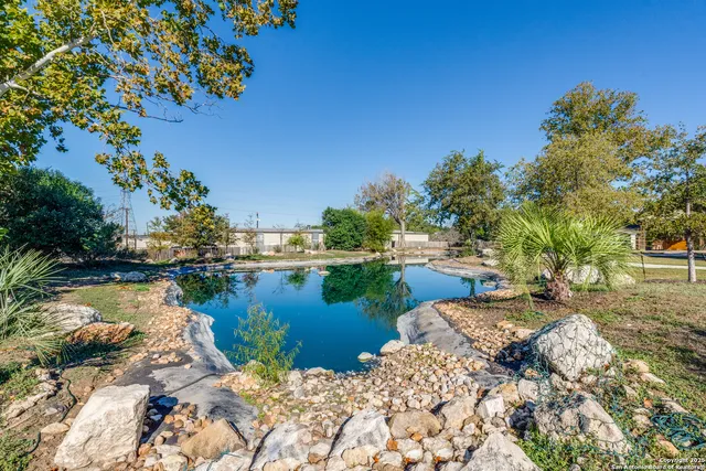 a view of a swimming pool with a patio