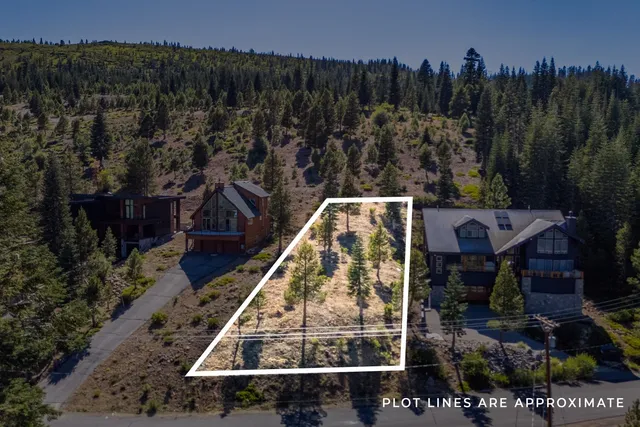a aerial view of a house with a yard