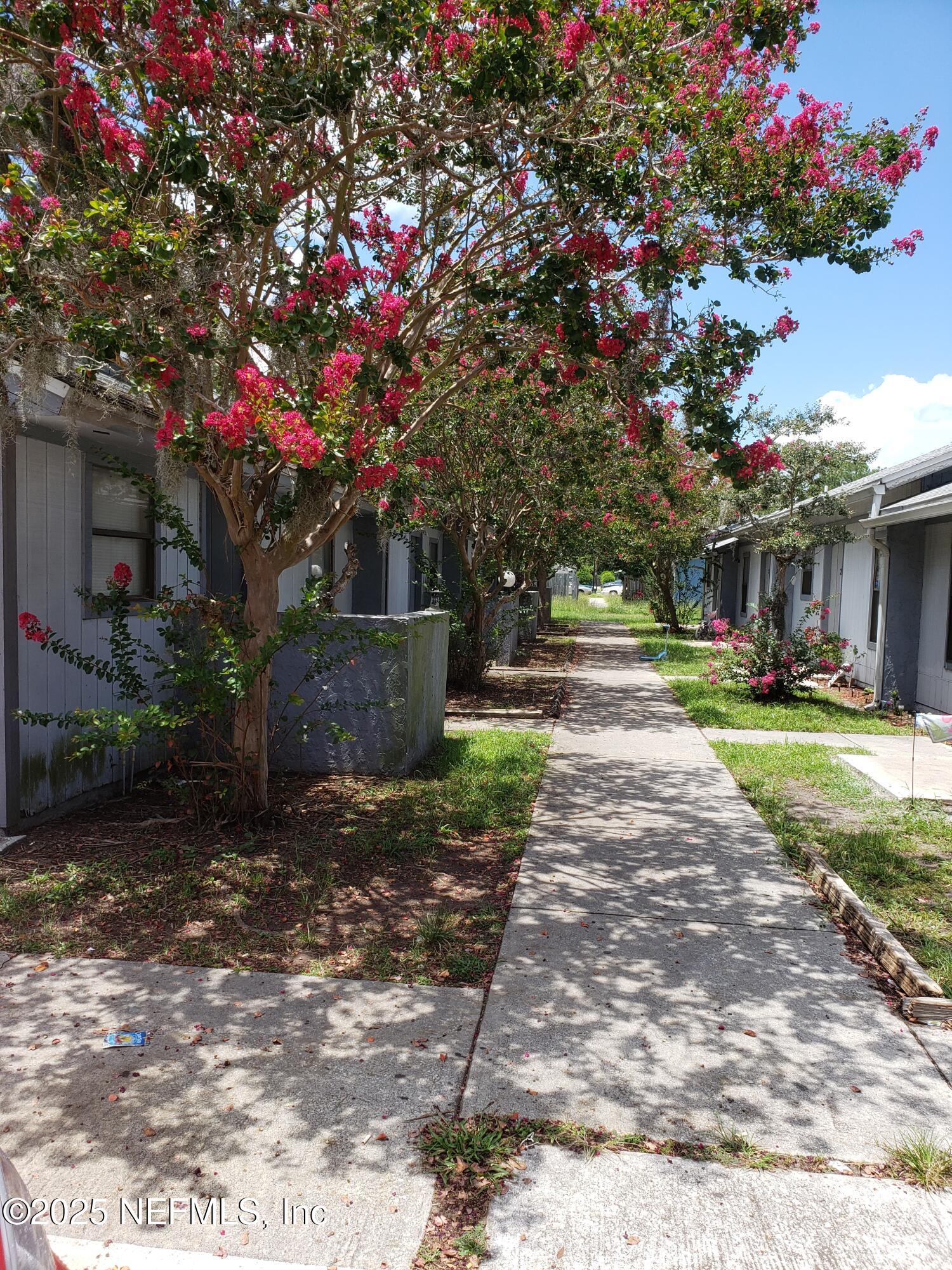 5138 Ricker Road, Unit 2 Jacksonville, FL 32210 - Photo 1 of 17 a front view of a house with garden