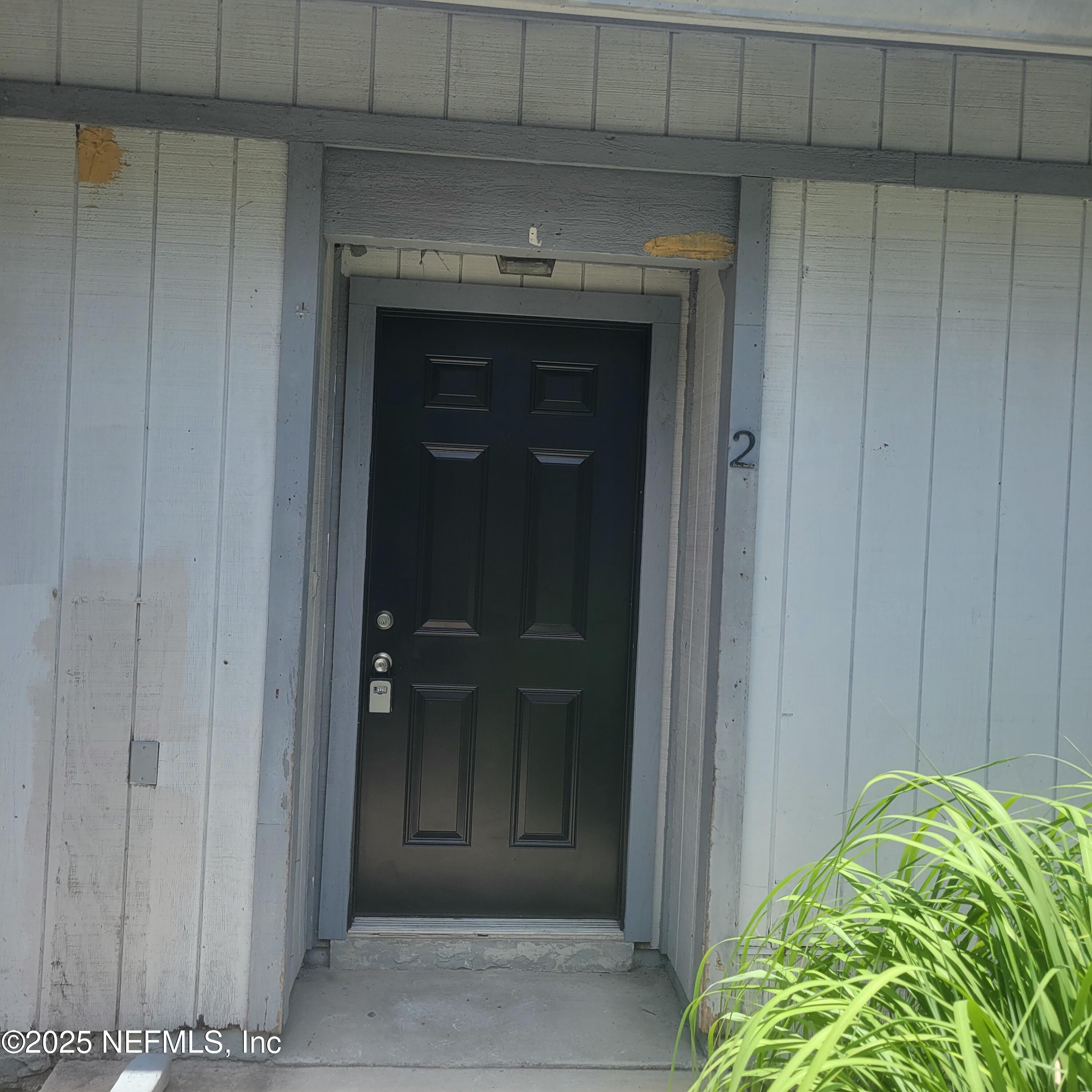 5138 Ricker Road, Unit 2 Jacksonville, FL 32210 - Photo 2 of 17 a view of front door