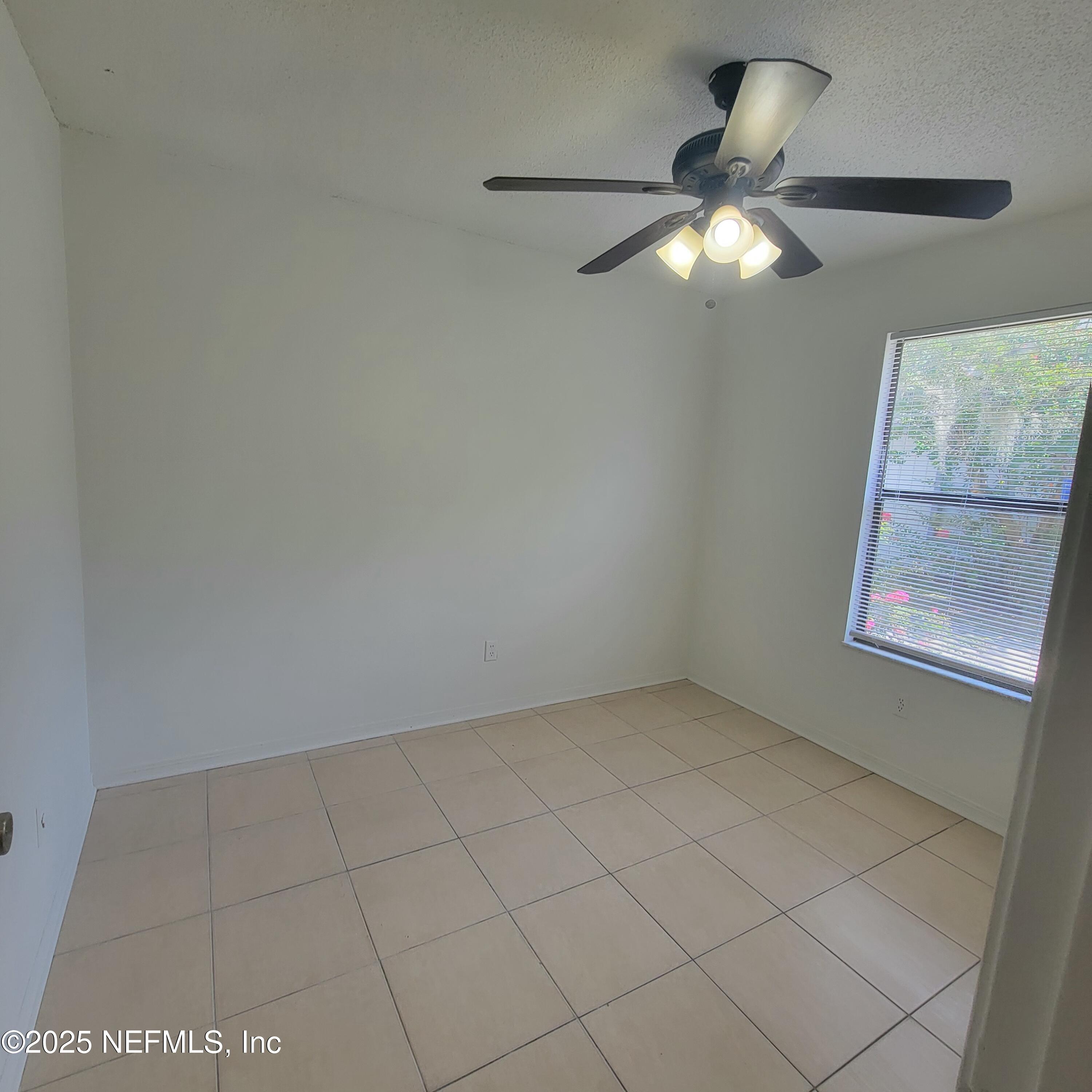 5138 Ricker Road, Unit 2 Jacksonville, FL 32210 - Photo 6 of 17 an empty room with a window