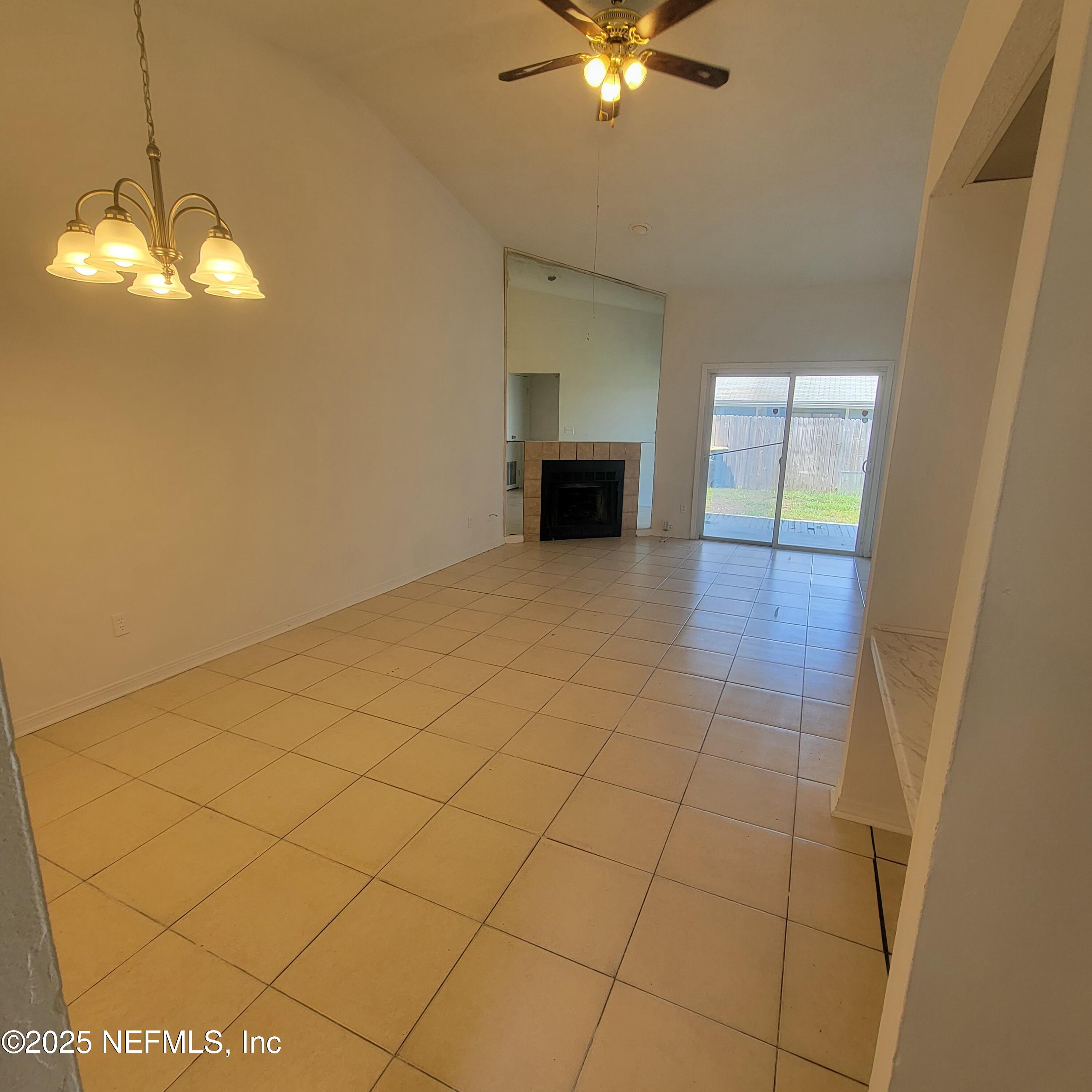5138 Ricker Road, Unit 2 Jacksonville, FL 32210 - Photo 7 of 17 a view of a livingroom with a chandelier