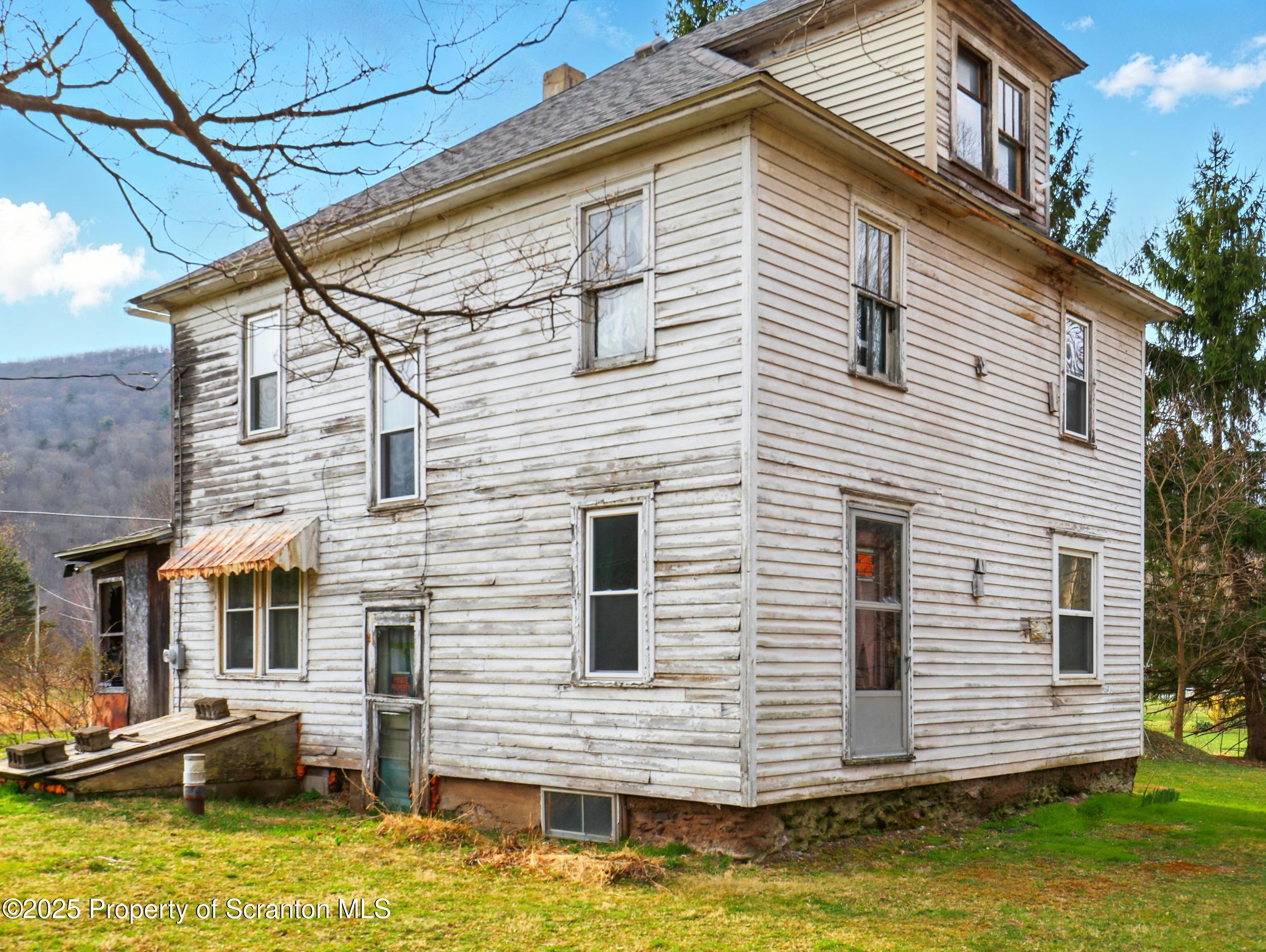 110 Bluegrass Road Tunkhannock, PA 18657 - Photo 1 of 17 a view of a house with a yard and furniture