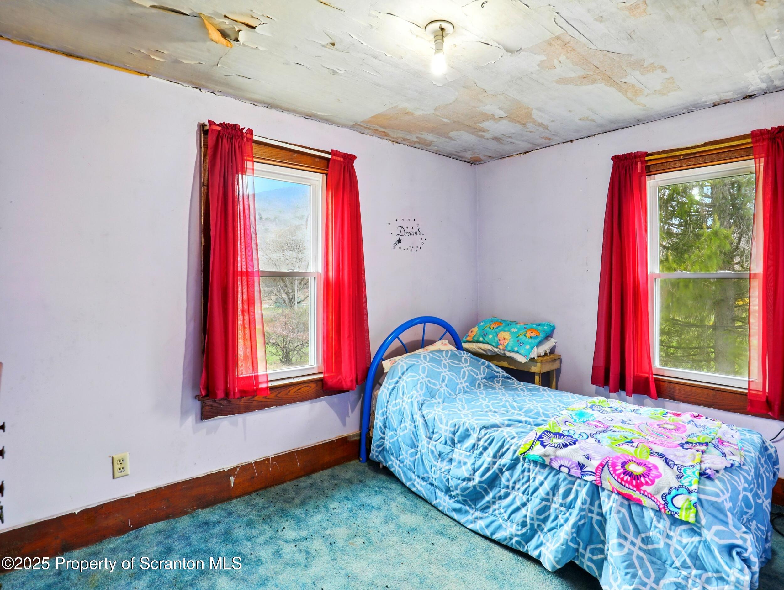110 Bluegrass Road Tunkhannock, PA 18657 - Photo 12 of 17 a bedroom with a bed and a window
