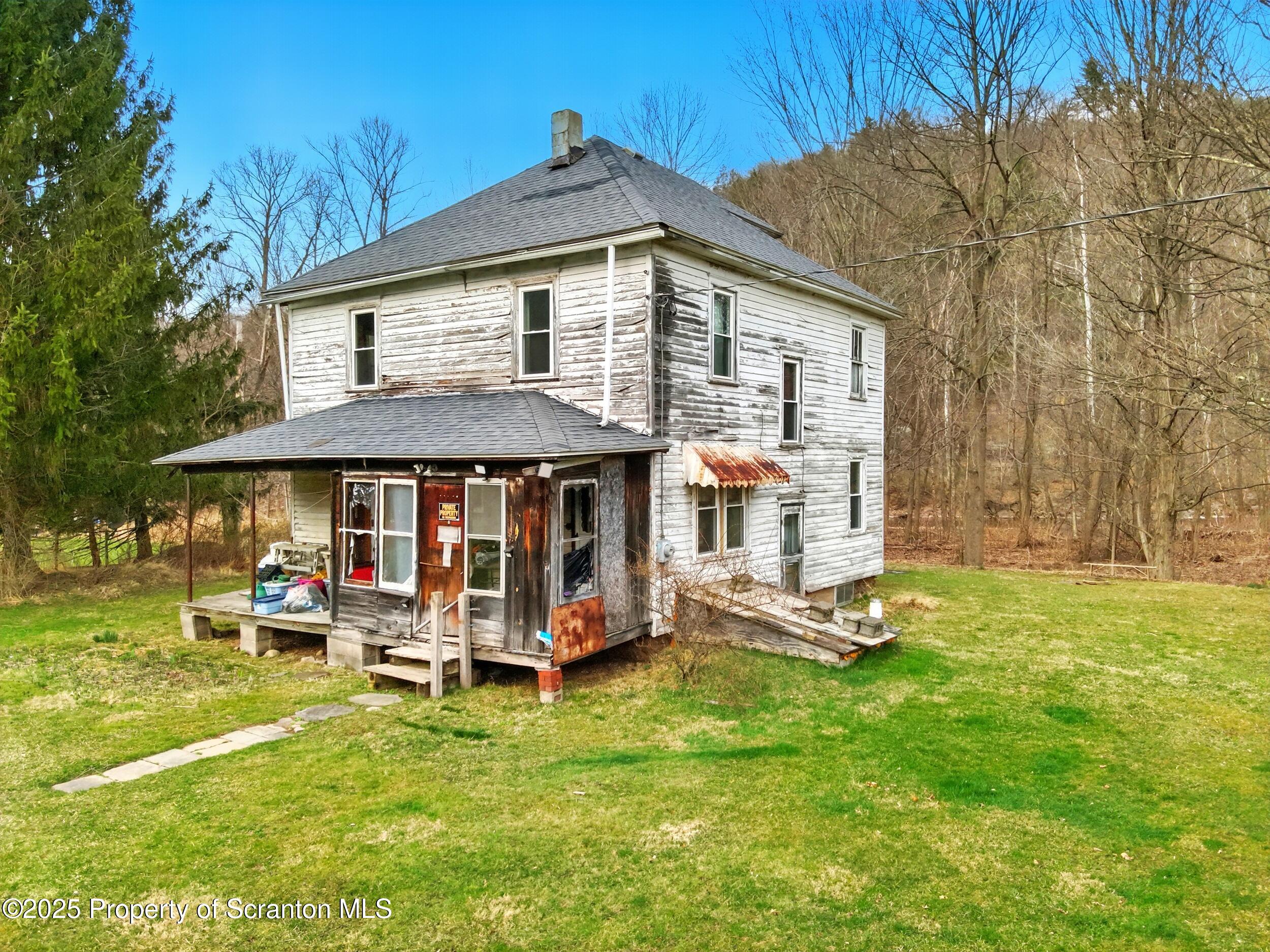 110 Bluegrass Road Tunkhannock, PA 18657 - Photo 4 of 17 a backyard of a house with table and chairs