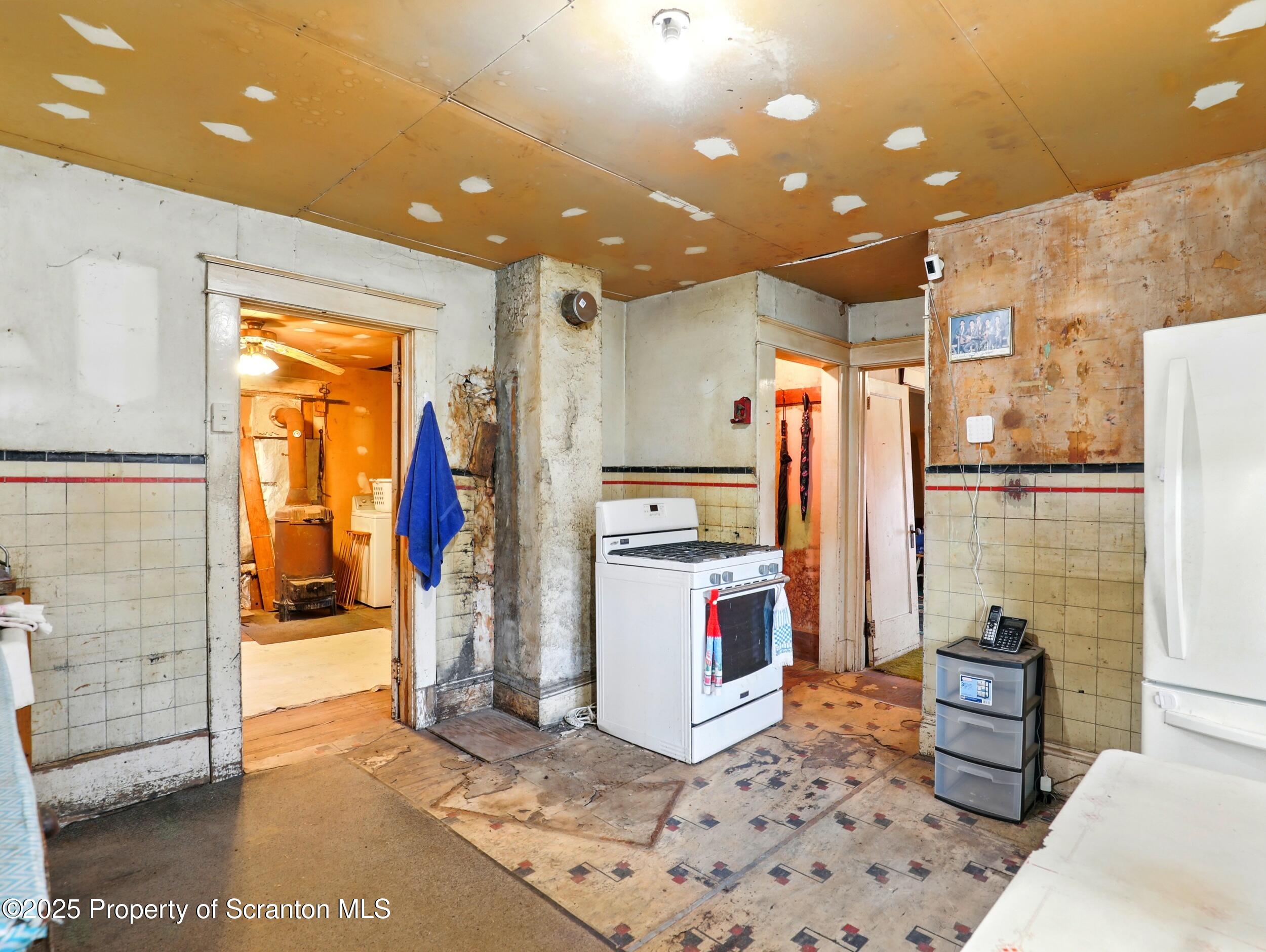 110 Bluegrass Road Tunkhannock, PA 18657 - Photo 6 of 17 a kitchen with stainless steel appliances kitchen island granite countertop a refrigerator and a stove