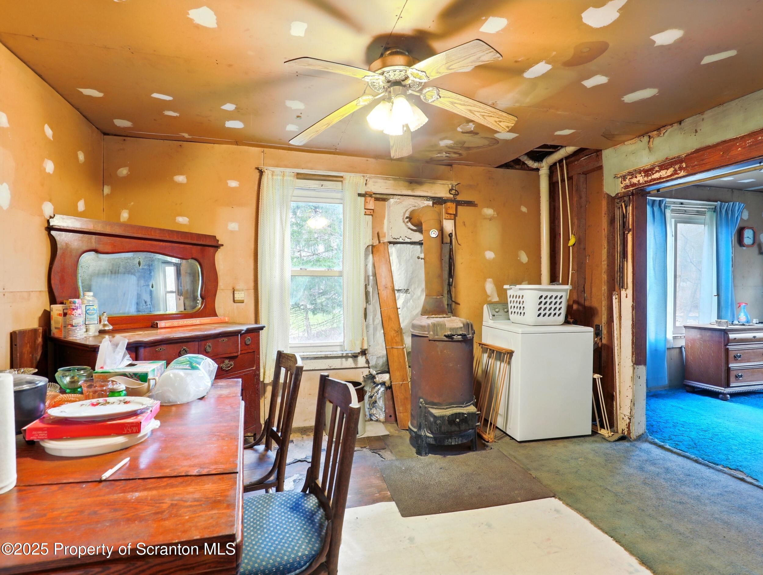 110 Bluegrass Road Tunkhannock, PA 18657 - Photo 8 of 17 a view of a dining room with furniture a chandelier and kitchen view
