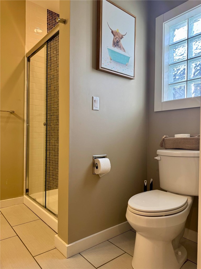 14310 Ridley Way Corpus Christi, TX 78418 - Photo 18 of 19 a bathroom with a toilet a sink and a shower