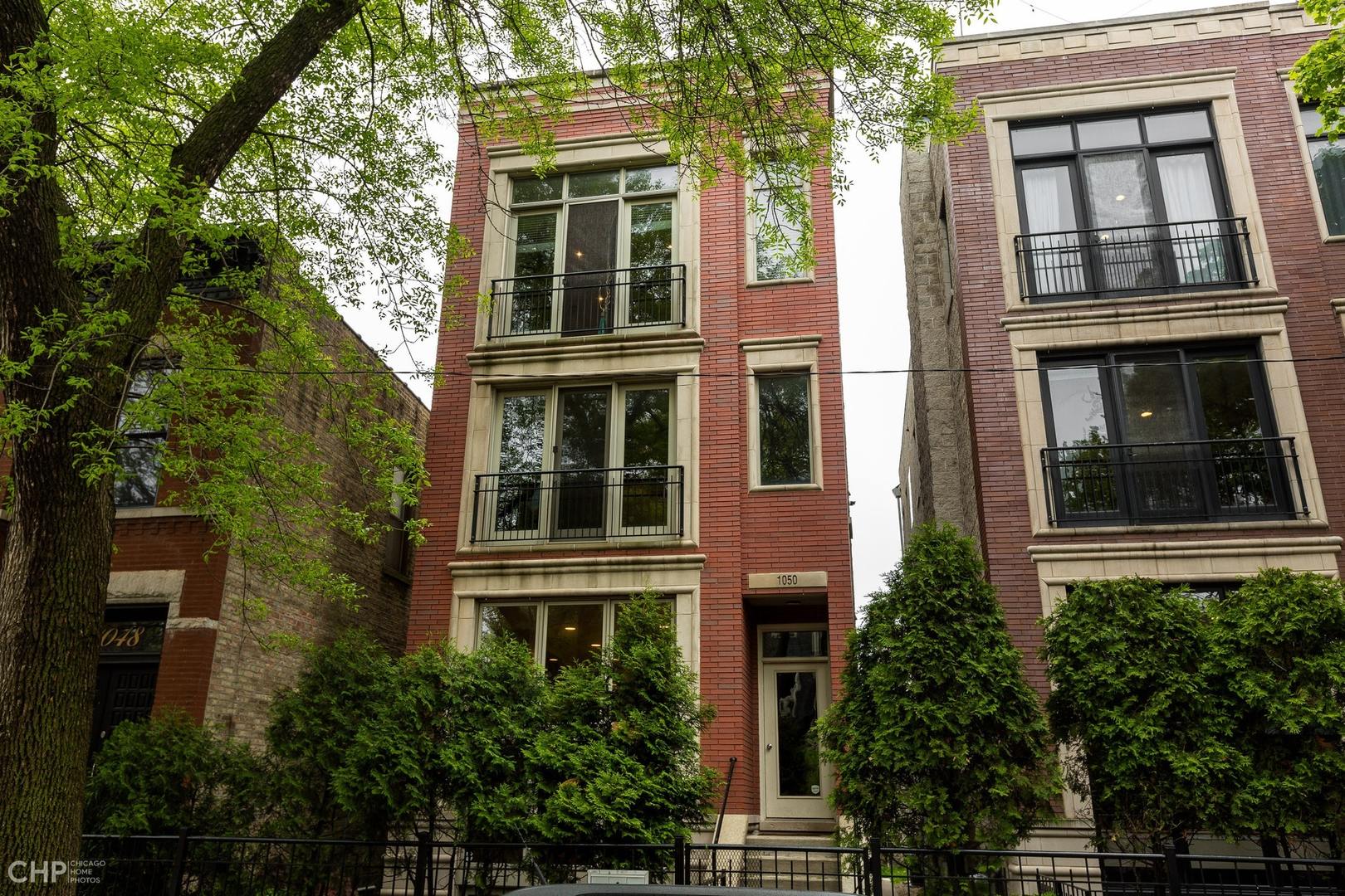 1050 North Hermitage Avenue, Unit 1 Chicago, IL 60622 - Photo 1 of 18 front view of building with a window