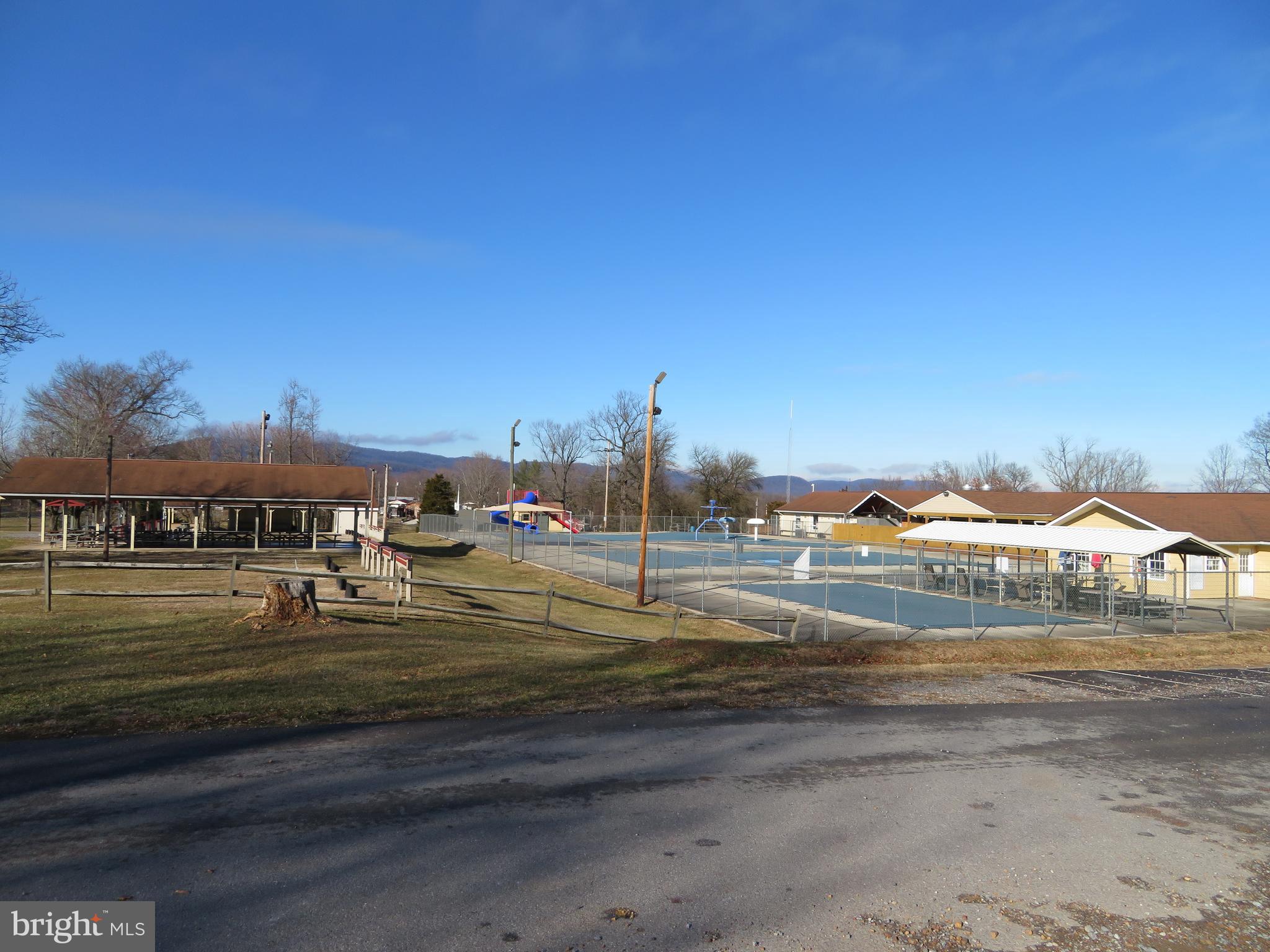 24 Ranger Road Falling Waters, WV 25419 - Photo 21 of 27 a view of grassy field with houses