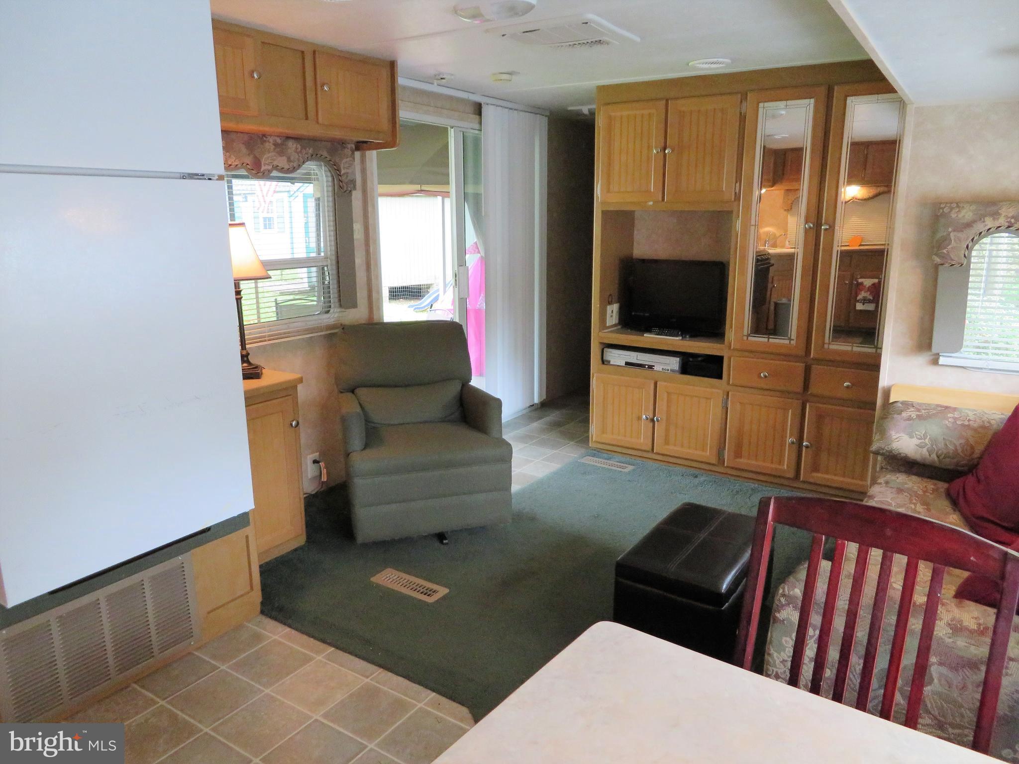 24 Ranger Road Falling Waters, WV 25419 - Photo 6 of 27 a living room with furniture and a flat screen tv
