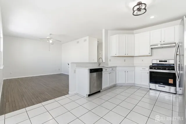 a kitchen with a cabinets and a stove top oven