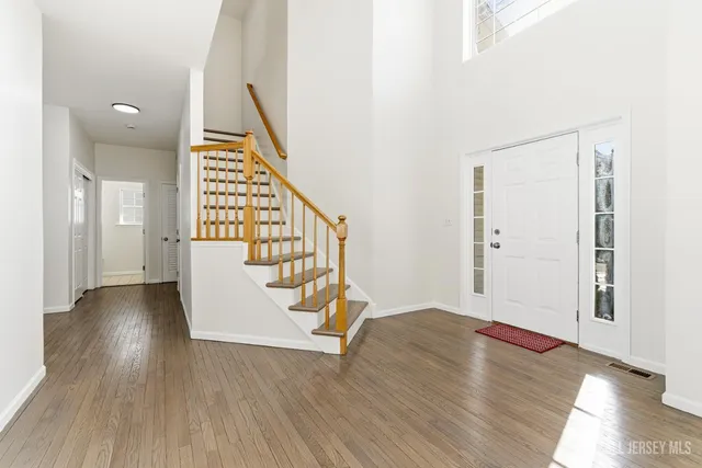 a view of entryway with wooden floor